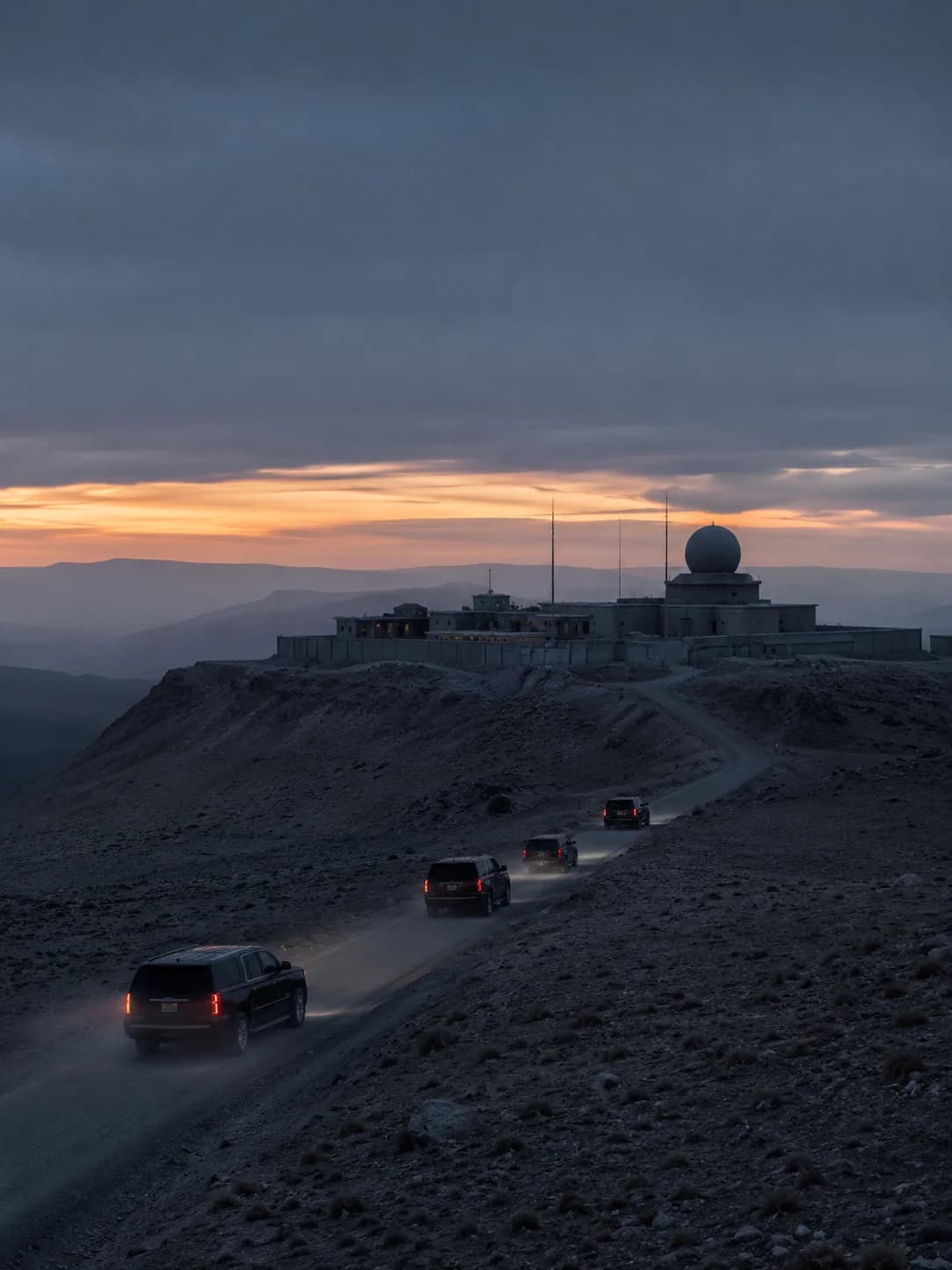 a hilltop station road at dusk